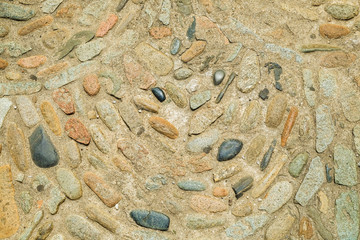 Ancient road surface paved with cobblestone in Switzerland. Background and texture for design.