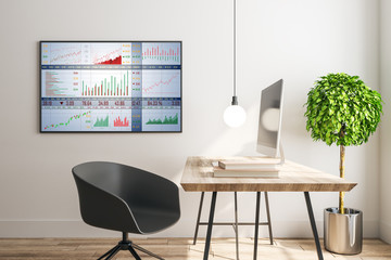 Workspace with computers and stock chart on plasma screen