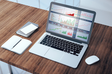 Top view laptop with stock chart on screen