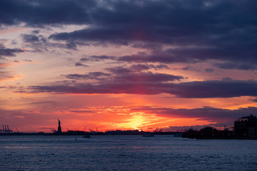 Fototapeta na wymiar Winter Sunset view of Statue of Liberty and Upper New York Bay