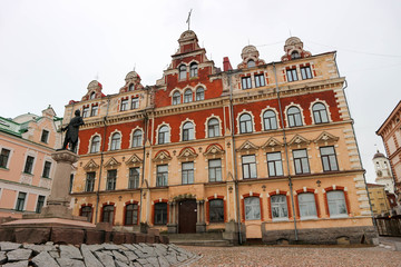 Fototapeta premium Vyborg old town hall with monument of city founder, Russia