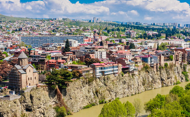 Fototapeta premium Panoramic view of Tbilisi city from Sololaki Hill, old town and modern architecture. Georgia
