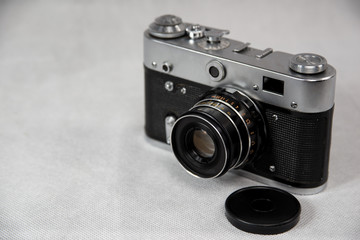 old camera with lens on a white background