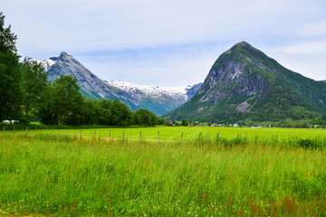 Obraz premium View of the glaciers and the surrounding mountain landscape from the Glacier Museum (Bremuseum) in Fjaerland. Norway.