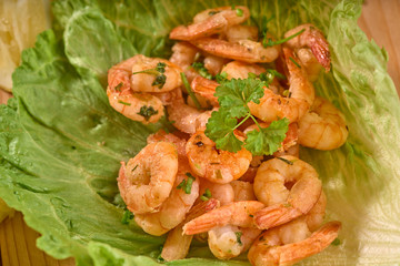prawns in lettuce on a wooden table