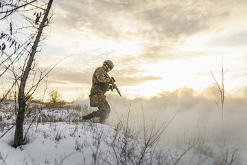 desperate American soldier breaks penetrat through the smoke to attack enemy. the atmosphere of a...