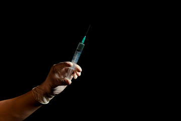 Syringe, medical injection in hand, palm or fingers. Medicine plastic vaccination equipment with...