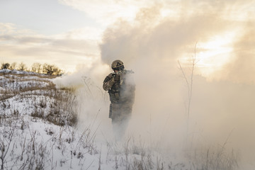 Soldier army man running through the smoke and explosions sun backlight and smoke background....