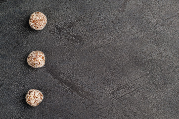 Energy balls close-up on a dark background with copy space, flat lay.