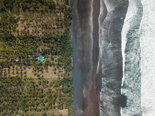 Aerial view of house with pool near the beach