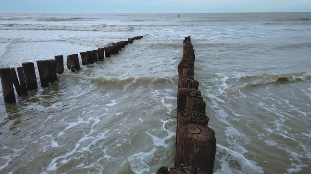 Waves breaking on wavebreaker at stormy weather, Domburg, Netherlands