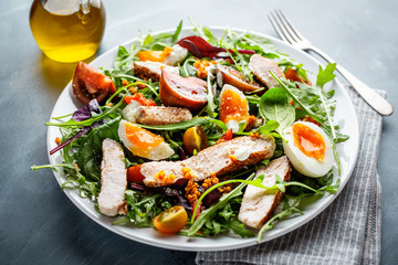 Fresh salad with turkey, eggs and vegetables