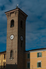 Clock tower on square Piazza della Liberta, in Bagnacavallo, Italy