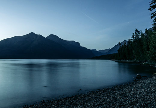 long exposure peaceful Lake McDonald, Glacier Park, Montana at sunset