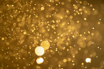 Golden glitter bokeh of light.Abstract blurred light