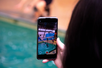 Girl shoot something on the phone, videoshoot  