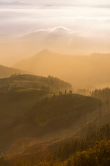 Obraz premium sunset on the green hills in basque country, spain