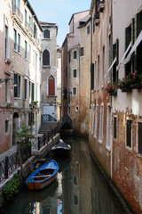 Obraz na płótnie Canvas Venice street view with canal and boats