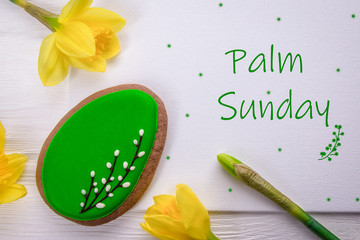 Sweet gingerbread and spring daffodils flowers. Holiday card. Religion holiday palm sunday
