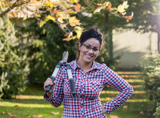 Woman with hedge scissors