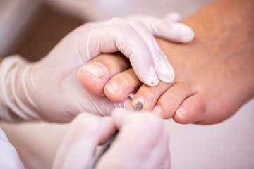 Close up of nail surface cleaning