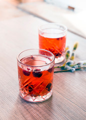 Red cranberry compote and willow on the table