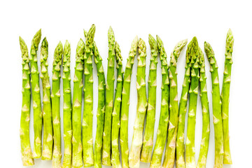 Fresh raw asparagus on white background top-down