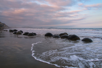 Fototapeta na wymiar Moeraki Boulders on Koekohe Beach, Otago, South Island, New Zealand.