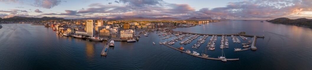 Drone photo of Bodø city lit by the midnight sun.