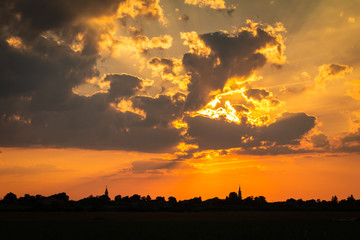 Colorful Sunset Setting Over Small Village