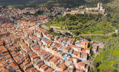 aerial view of bosa town with his colored houses and the castle in background