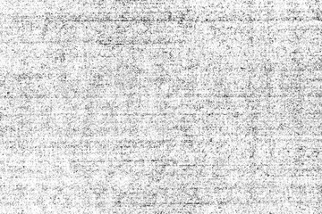 Grunge texture of old shabby paper. Vintage monochrome background of an aged empty book page with small noise, horizontal stripes, spots and graininess. 