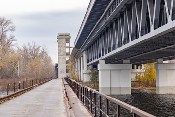 Old and new Bridges. Unfinished grey construction