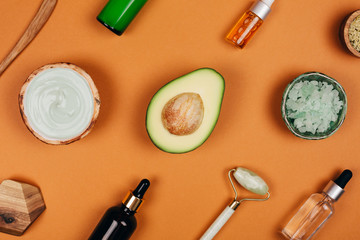 Modern accessories and herbal cosmetics for natural face care. Flat lay style.