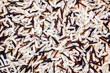 Macro photo background of white and brown rice mixed together.
