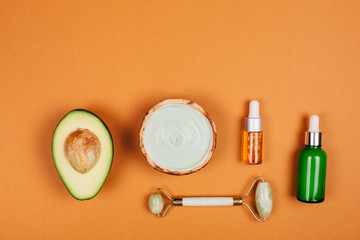Modern accessories and herbal cosmetics for natural face care. Flat lay style.
