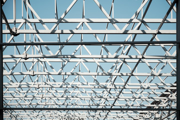 Metal constructions. Large warehouse building under construction