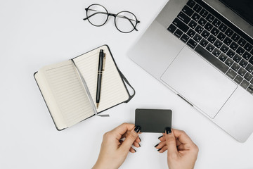 Hands holding credit card and using laptop. Online shopping 