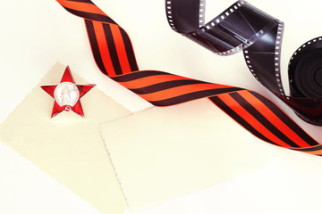 George Ribbon, black and white photo film with archive photos, Order of the Red Star. The concept of the archive of memory, history, patriotism. Victory Day, May 9, festive background.