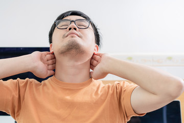 Obraz premium Tired Asian men work at home