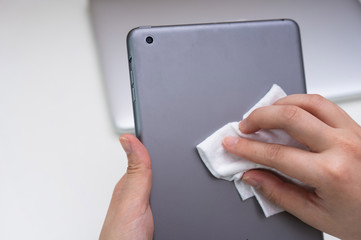 Asian women clean office electronic equipment