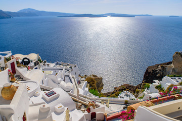 Naklejka premium Traditional white buildings facing Aegean Sea in Oia, Santorini island, Greece