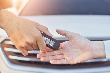 Salesman giving key car to customer,Car sale concept