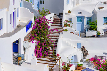 Fototapeta na wymiar Traditional white buildings facing Aegean Sea in Oia, Santorini island, Greece