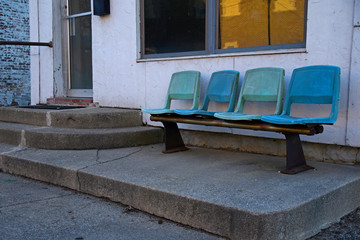 Empty seating outside a small resturant 