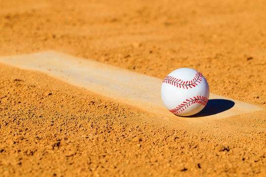 Baseball or Softball on Dirt Mound 