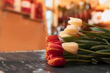 Obraz na płótnie Canvas Vintage effect, tulips on flower shop table 