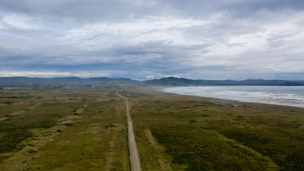 A small ground road next to the beach at Chiloe Island, Chile