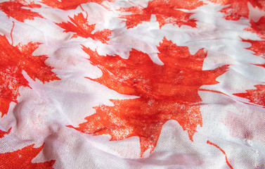 Maple leaf fabric. Red and white. Close up. Symbol of Canada.