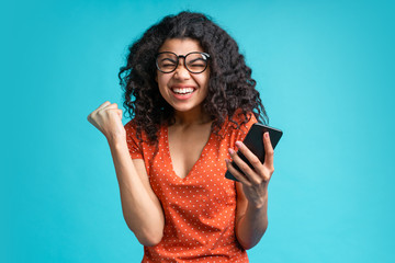 Portrait of attractive young african american girl using mobile phone